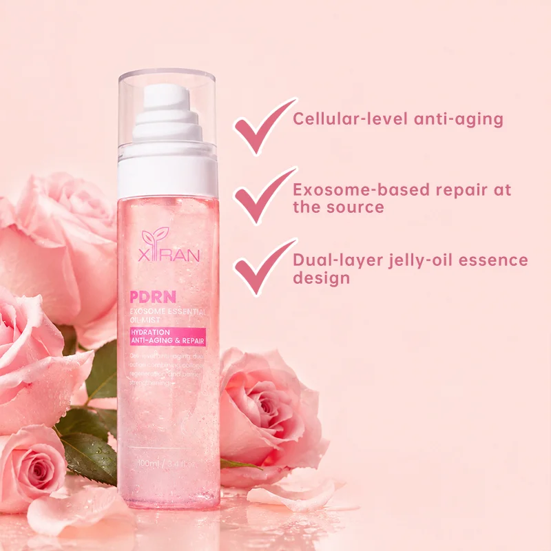 A pink oil mist bottle labeled PDRN Exosome Essential Oil Mist with hydration and anti-aging benefits, surrounded by pink roses.